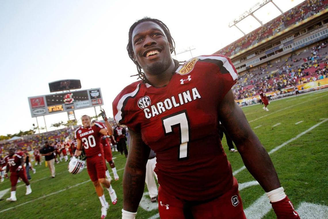 South Carolina defensive end Jadeveon Clowney (7) celebrates the Gamecocks’ win over Michigan in the Outback Bowl.