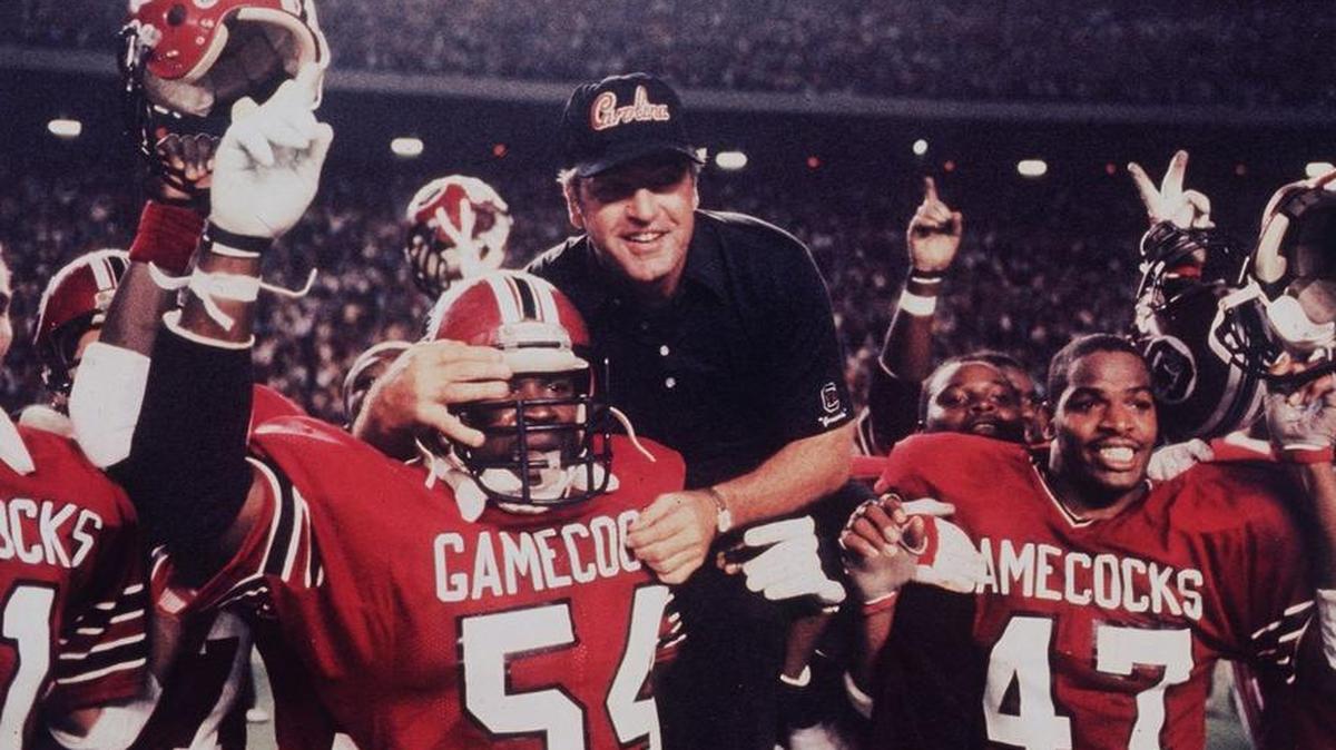 Then-USC CoachJoe Morrison and his players celebrate their win over Florida State during the 1984 Black Magic season. The win brought the Gamecocks to 9-0 and ranked No. 2 in the country.