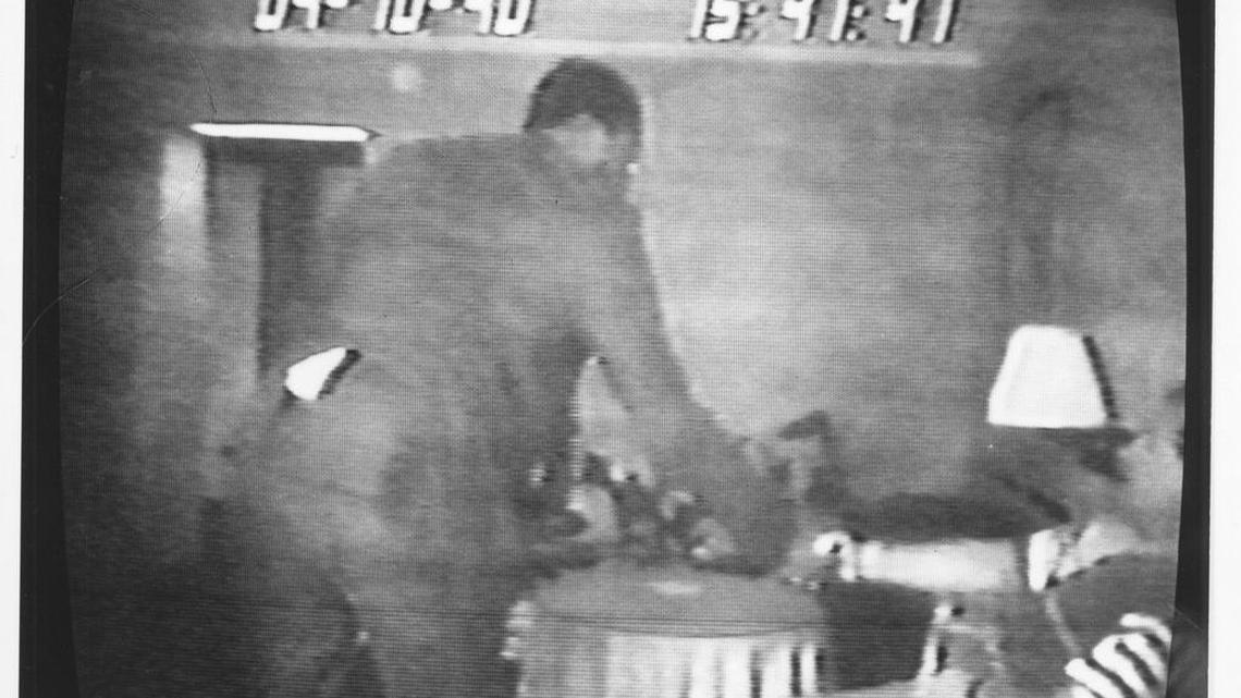 
Grainy black-and-white videos of lawmakers accepting bribes were the linchpin of the FBI’s 1990 State House sting. Here, a House member thanks lobbyist-turned-FBI operative Ron Cobb for a cash “donation.”
