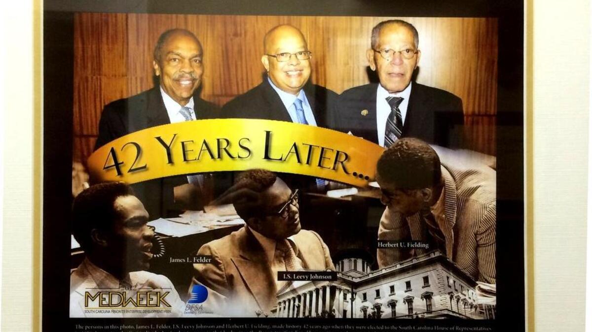 A photograph hanging in I.S. Leevy Johnson’s law office in downtown Columbia shows a photograph commemorating the 1970 election of three African-Americans to the S.C. House of Representatives. They posed together more than four decades later.