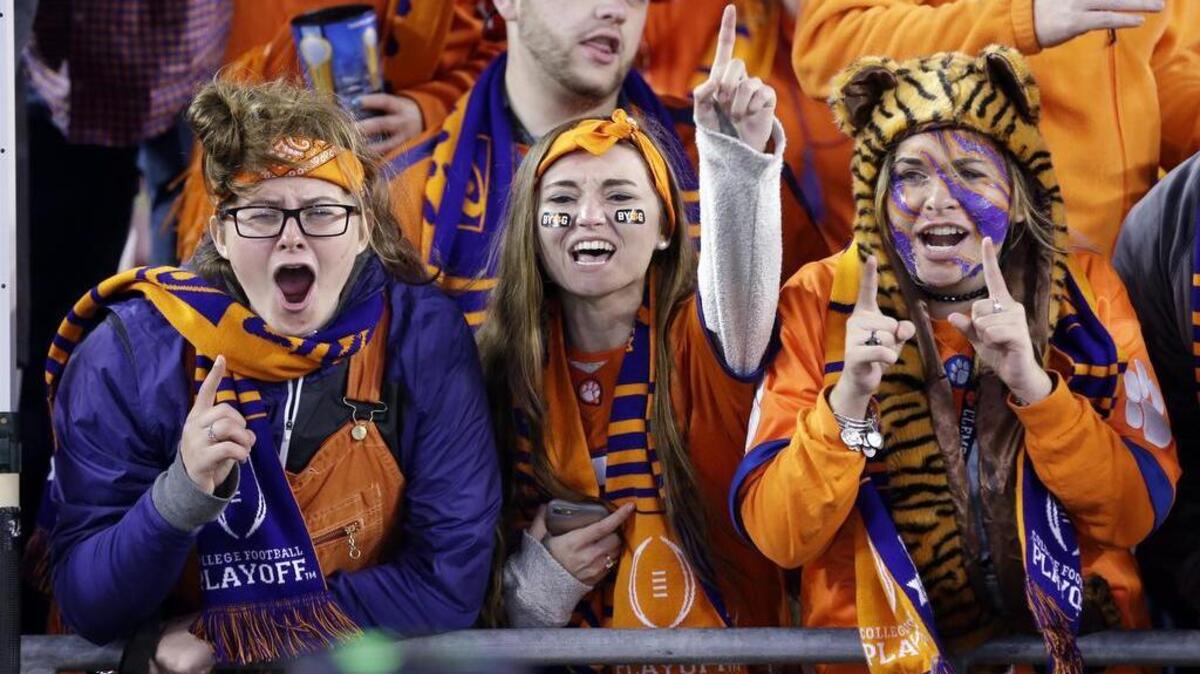 File photo. Clemson fans celebrate after the NCAA college football playoff championship game against Alabama Tuesday, Jan. 10, 2017, in Tampa, Fla. Clemson won 35-31.