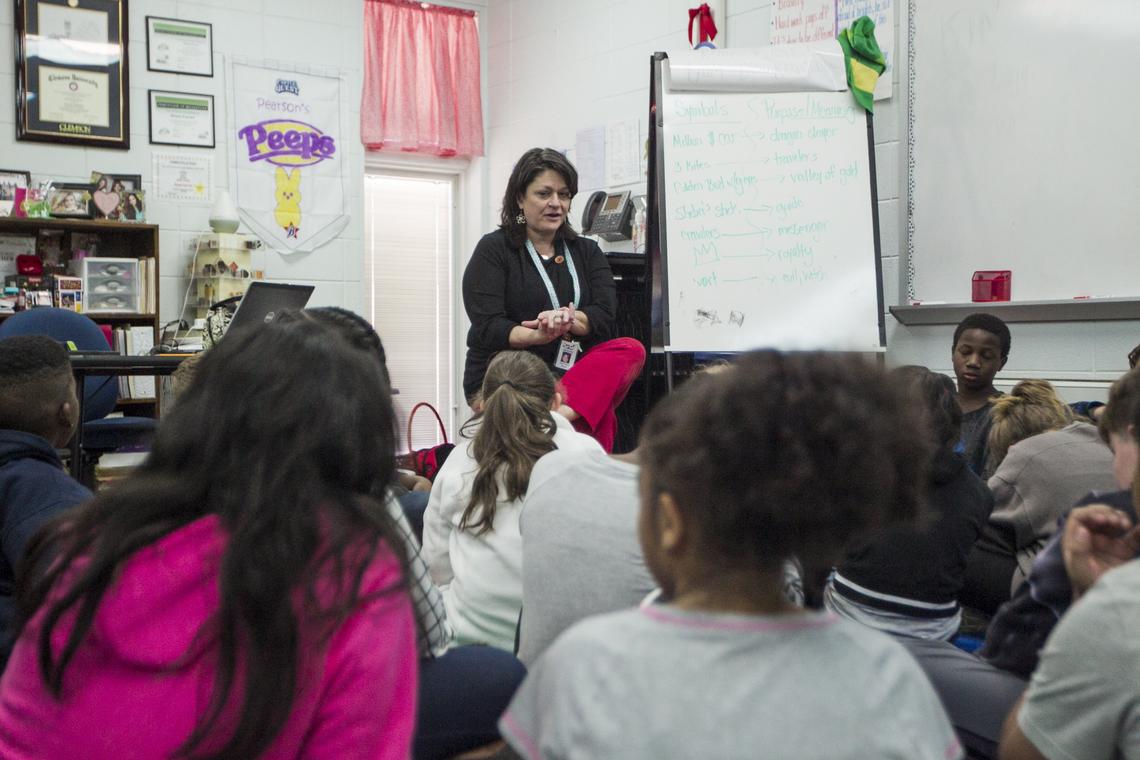 Diana Pearson talks to her class about their stories before they go to work during class. Pearson teaches the fifth grade at Lakeview Elementary School and will visit her students on the weekend during her days off.