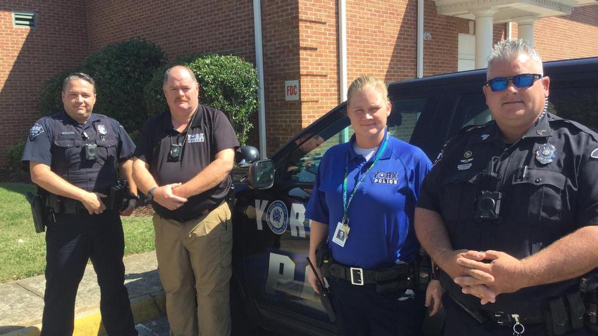 Four of many York Police Department officers who threw a birthday party and helped five kids Wednesday after arresting the mother of the children for shoplifting, child neglect and other charges. From left to right, Cpl. Ken Sibley, Lt. Dale Edwards, Cpl. Cheryl Gregory, Sgt. John Buchanan.