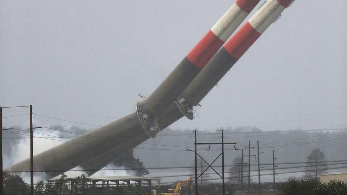The 300-foot tall stacks fall at the Grainger Generation Station in Conway on Sunday, Feb. 7, 2016. The Dolphus M. Grainger Power Station was retired at the end of 2012 after 50 years of coal-fired power generating. The stacks are visible throughout Conway. The plant is located off U.S. 501 bypass near Savannah Bluff. The stacks fell in less than 10 seconds.