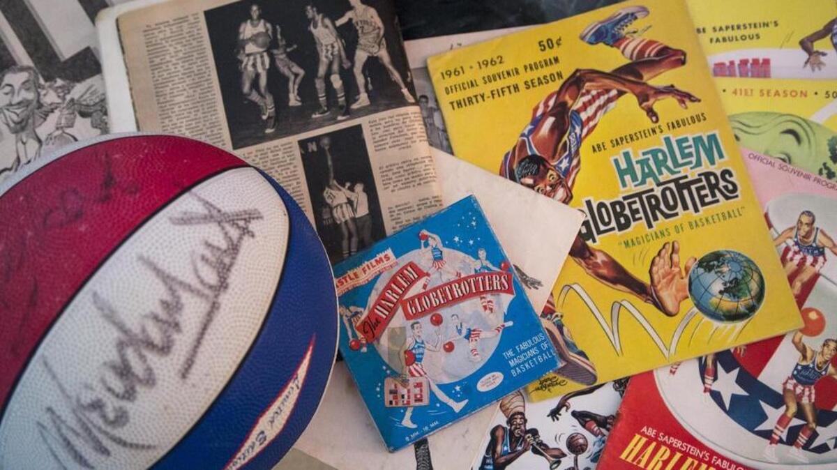 Tony Amendola sits with the memorabilia he collected when he traveled all around the world with the Harlem Globetrotters playing for the rival team in the early 1960s. Amendola recounts memories of playing with basketball greats such as Wilt Chamberlain and Meadowlark Lemon.