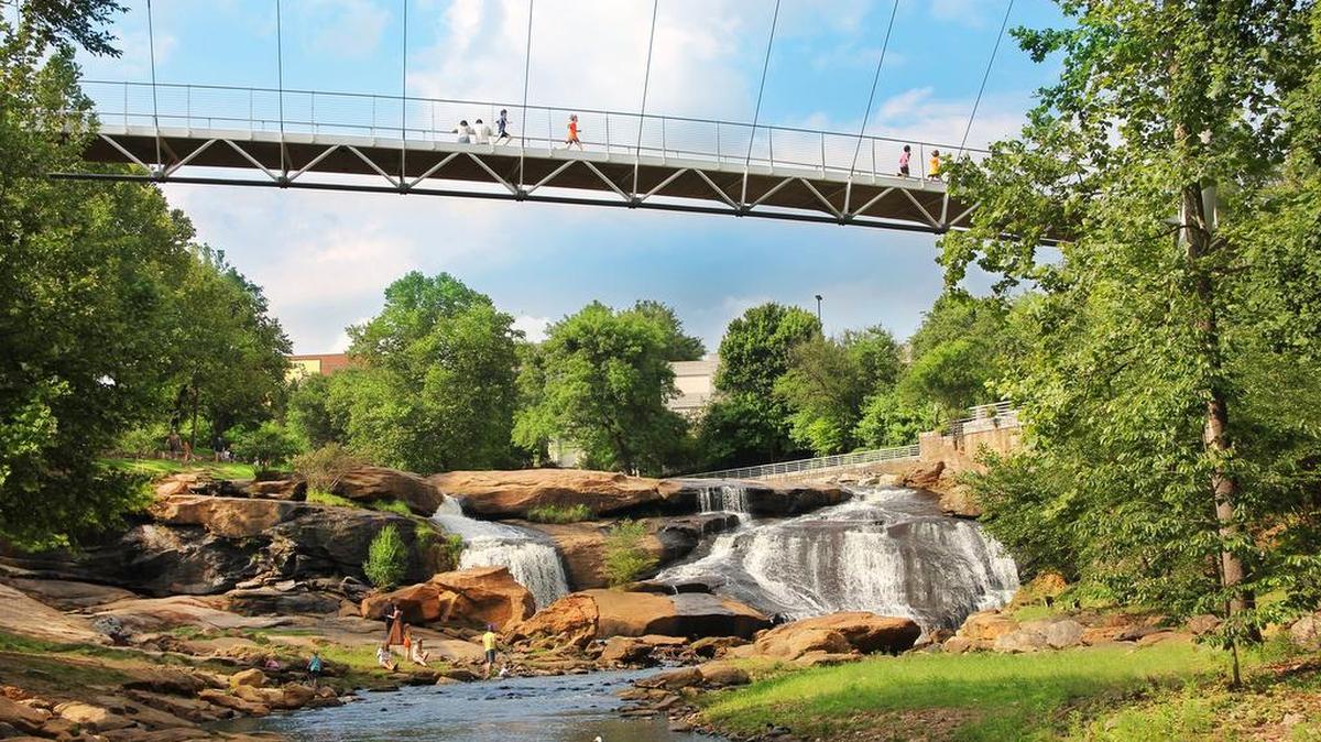 Liberty Bridge at Falls Park on the Reedy. A visit to Greenville is not complete without seeing the city's iconic suspension bridge, which spans the Reedy River above Falls Park.