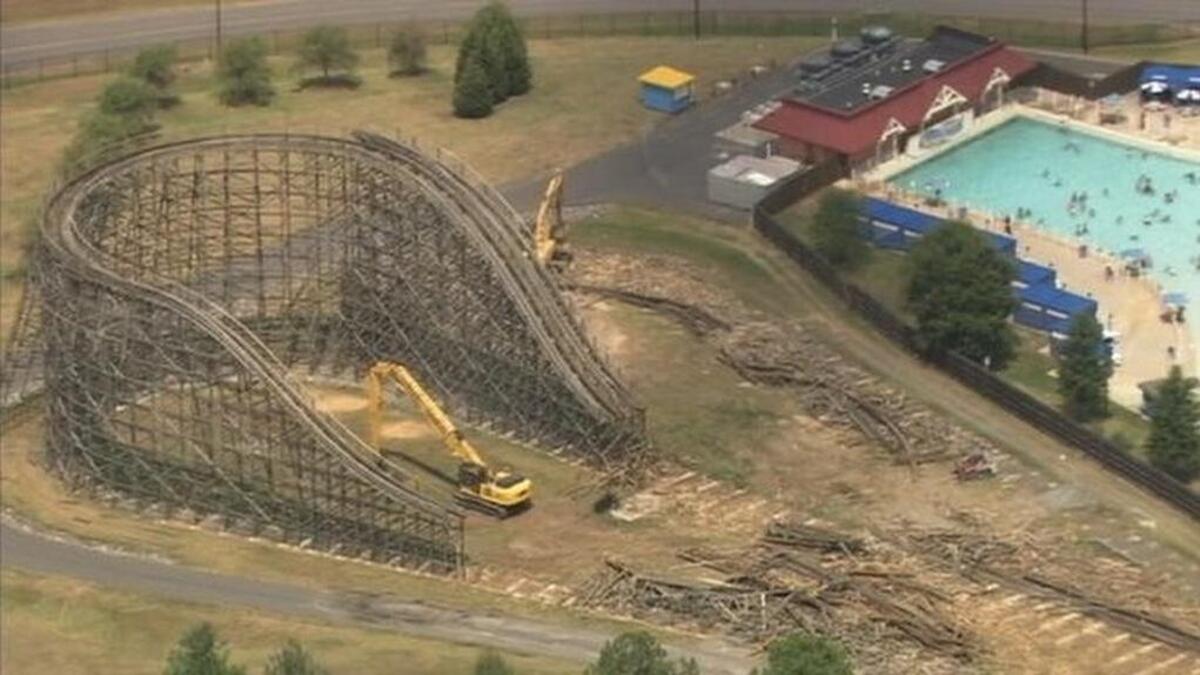 
Crews work to demolish Thunder Road Wednesday at Carowinds. 
