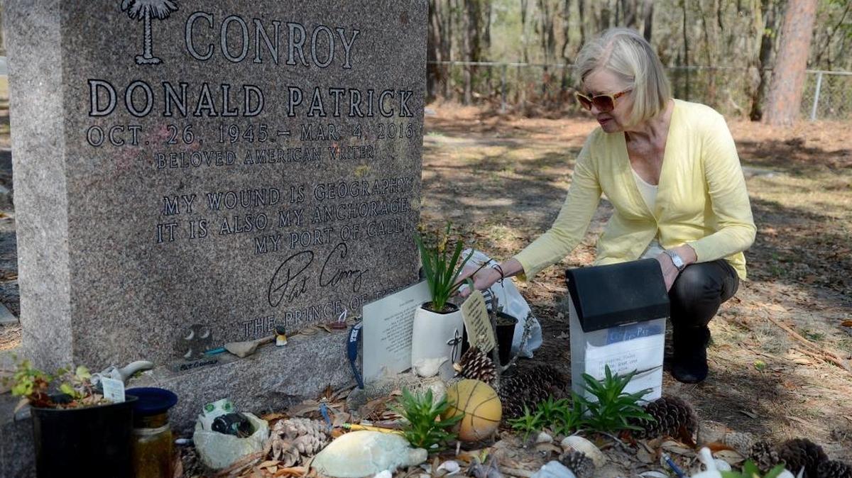 Cassandra King Conroy, Pat Conroy’s widow, straightens up his gravesite at St. Helena Memorial Garden, the annex cemetery of Brick Baptist Church, on Monday, Feb. 27, 2017, on St. Helena Island.