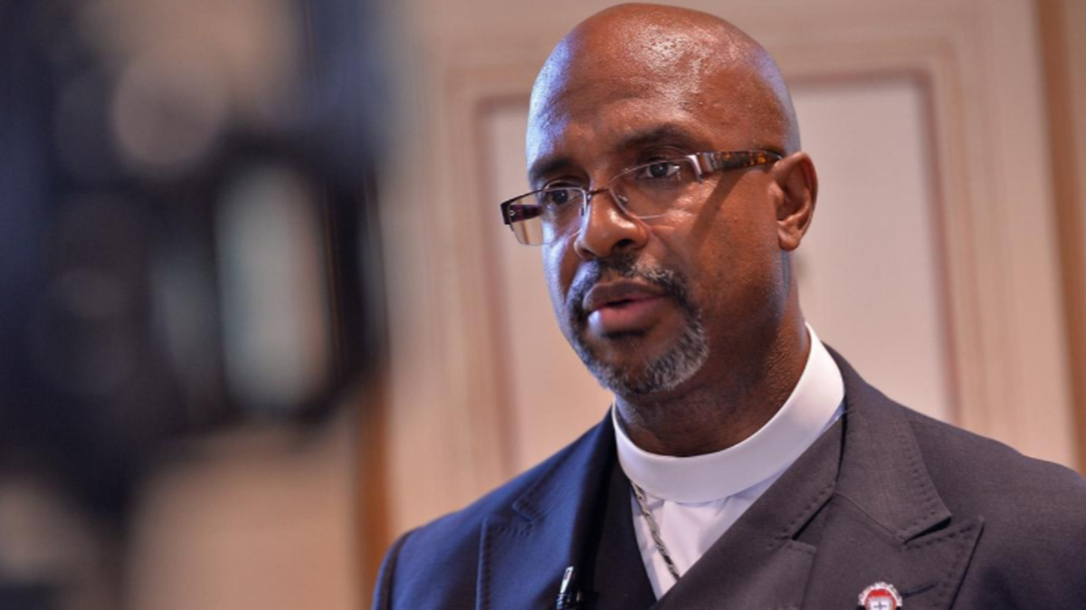 Rev. Eric Manning, senior pastor of Emanuel AME Church in Charleston, talks with students and reporters at USC Upstate in Spartanburg on Thursday. Manning spoke on race relations during a special event at the Hodge Center.