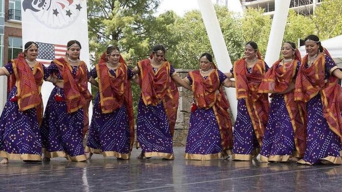 
India Day celebration in downtown Greenville featuring food, music and traditional costumes. KEN OSBURN 
