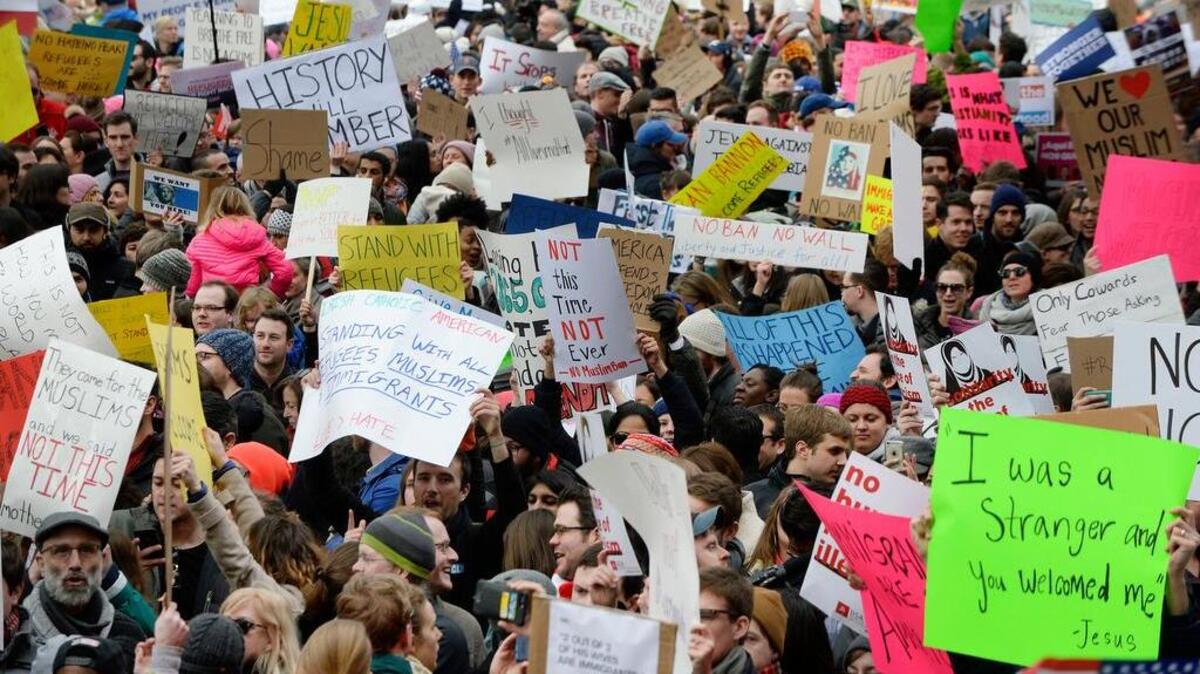 Massive crowds gather at the White House Sunday to protest President Donald Trump's immigration plan.