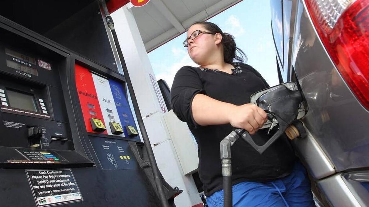 FILE PHOTO: In this 2013 photo, Jessica Flores drove to City Gas on North Main Street to fill her gas tank.