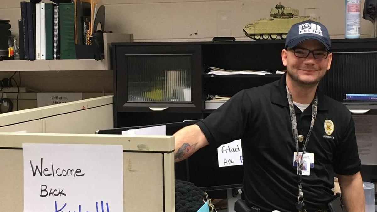 Sgt. Kyle Cummings, who was shot and injured Jan. 16, returned to work Wednesday.
