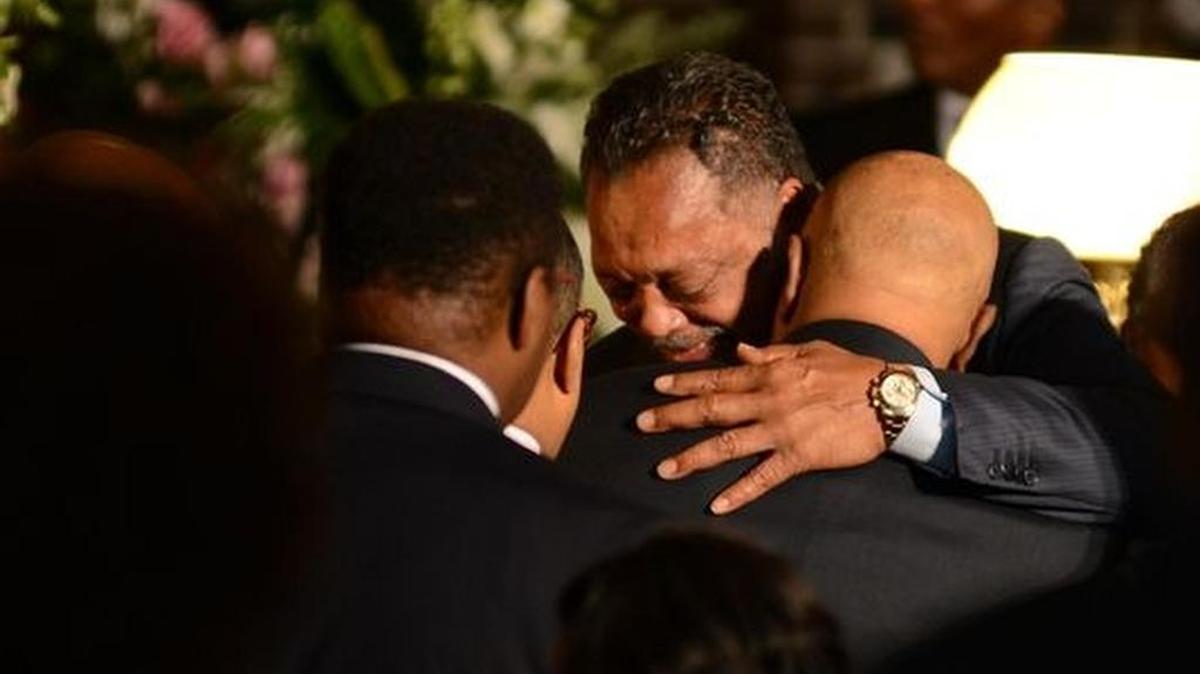 
Rev. Jesse Jackson is hugged during a service for his mother Helen Burns Jackson at Springfield Baptist Church on Monday.
