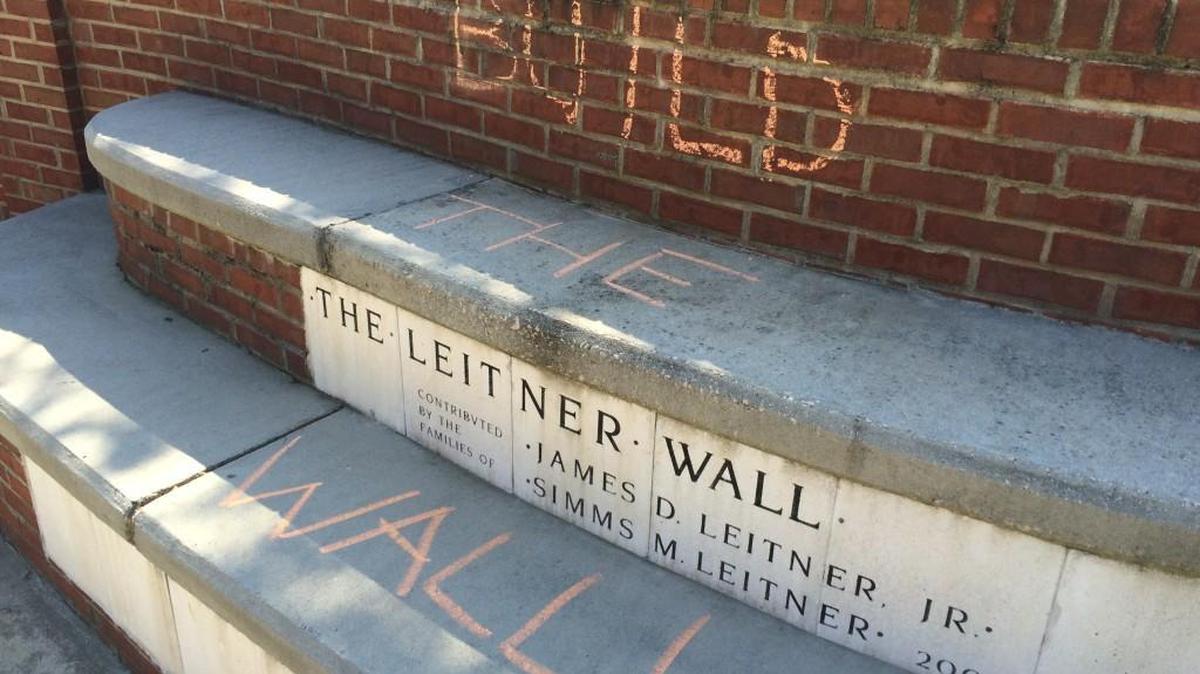 “Build the Wall!” is scrawled across the Leitner Wall at Winthrop University on Wednesday, one of several Trump-related chalkings that popped up overnight on campus.