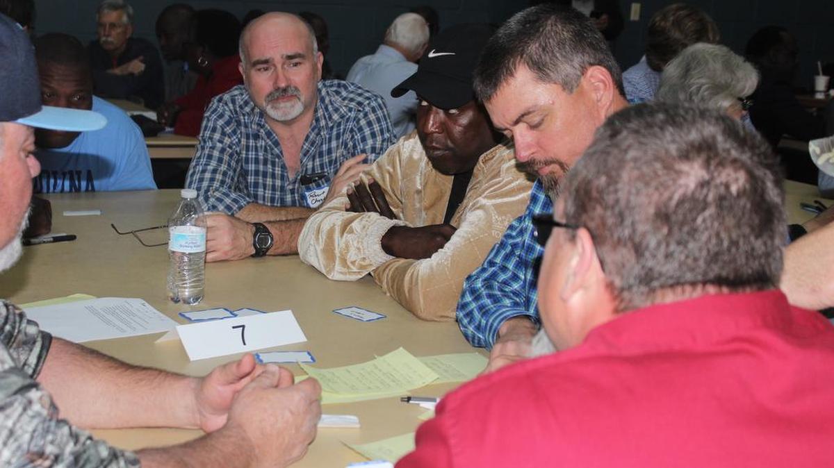 Georgetown residents create questions during a public meeting about the ArcelorMittal steel mill site.