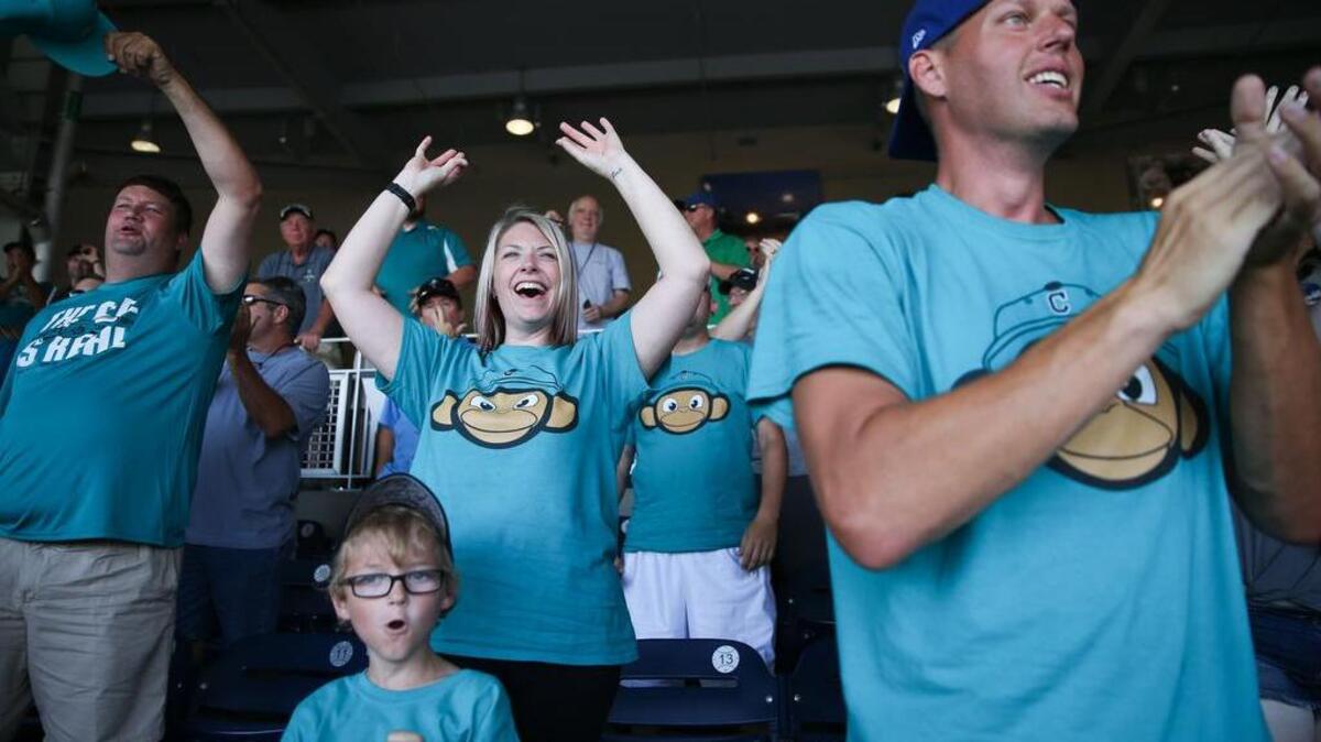 Sandi Knowski, from Omaha, cheers after Coastal Carolina keeps the game scoreless after a play at home in the third inning. Coastal Carolina played Arizona in Game 3 of the College World Series Finals at TD Ameritrade Park in Omaha, Neb.