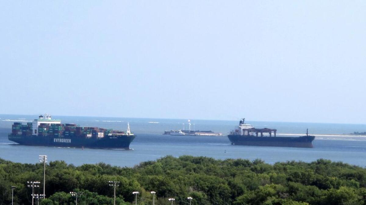 In this Sept. 6, 2012 photo, a ship passes while another sits anchored near Fort Sumter, in the middle of the harbor at Charleston, S.C.