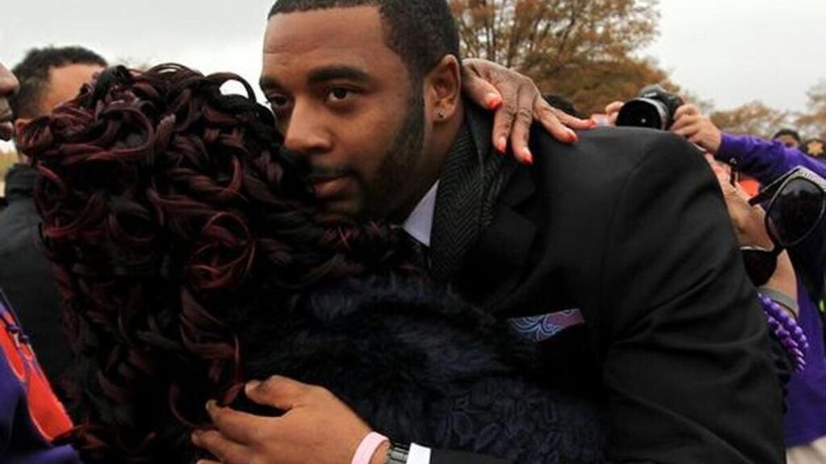 File Photo: Clemson quarterback Tajh Boyd hugs his mother in 2013 while walking to a Clemson game.