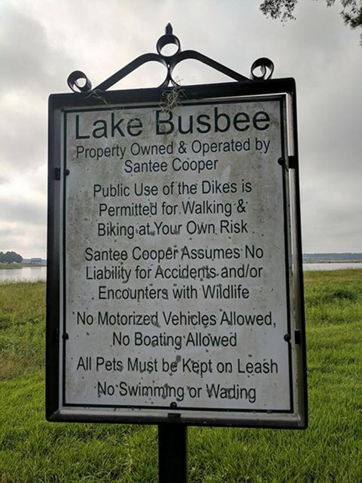 Old signs at Lake Busbee prohibited boating and swimming, but not fishing.
