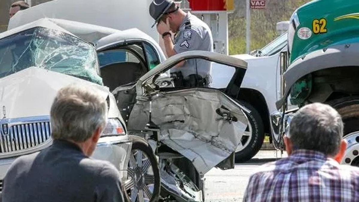 A South Carolina Highway Patrol officer looks over the scene of a wreck Friday afternoon at S.C. 24 and Whitehall Road. A Mack truck from Powell's Trash Services collided with a beige Lincoln Continental shortly after noon. The truck driver, left, was unharmed, but the driver in the car was taken to AnMed Health Medical Center by MedShore ambulance service.