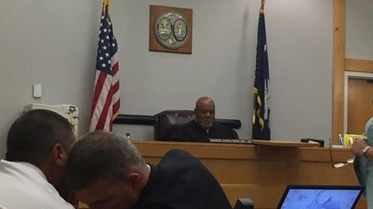 Judge Alex Kinlaw Jr. presides over a Family Court hearing to determine whether a teenager accused of killing his mother will be tried as an adult.