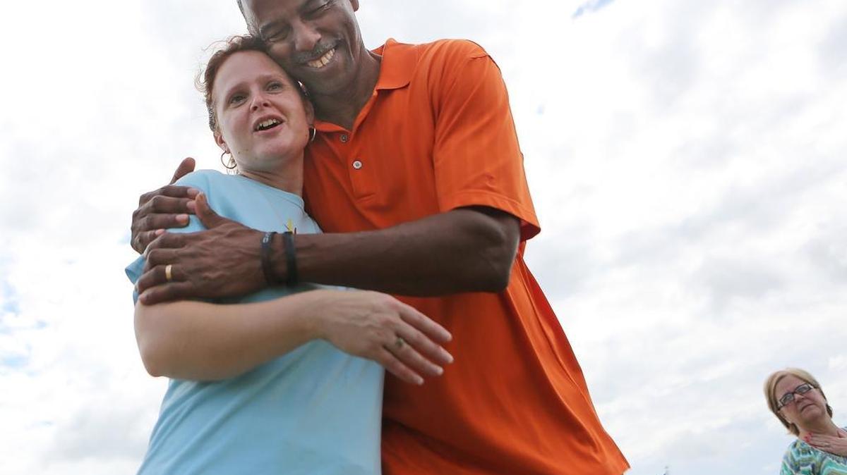 On Saturday July 1, 2017, Renee Davis and Andy Anderson embrace after praying for the city and all dealing with the Father's Day shootings on Ocean Boulevard in Myrtle Beach. The two are part of Together in Christ, a nondenominational group that gathers in prayer on the first Saturday of each month. The group is seen annually on Memorial Day in prayer tents on Ocean Boulevard.