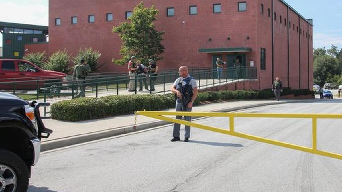A law enforcement officer stands at Townville Elementary School Sept. 28 after responding to a shooting.