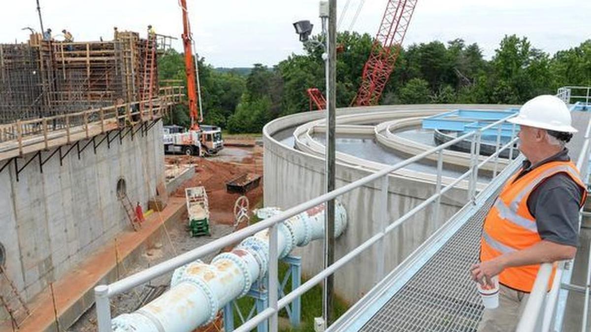 Scott Willett, executive director of the Anderson Regional Joint Water System in Anderson, looks over the construction of a new ozone treatment while standing on a water clarifier at the the treatment plant near Lake Hartwell.