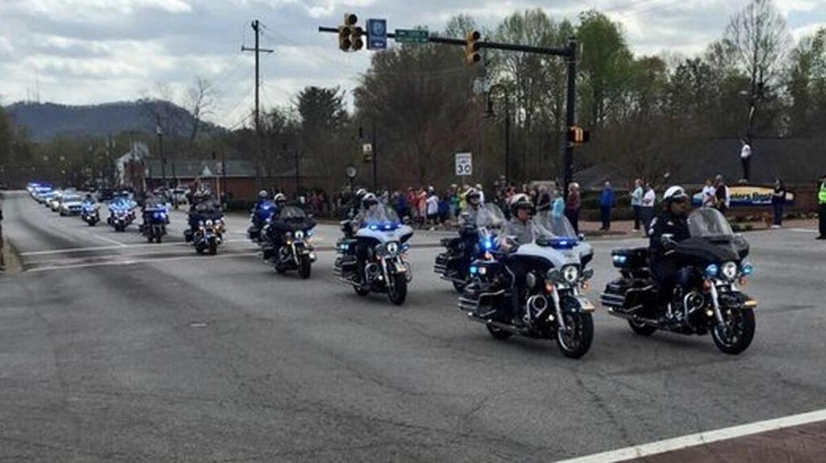 A procession leads fallen officer Allen Jacobs to his final resting place in Travelers Rest on March 24, 2016.