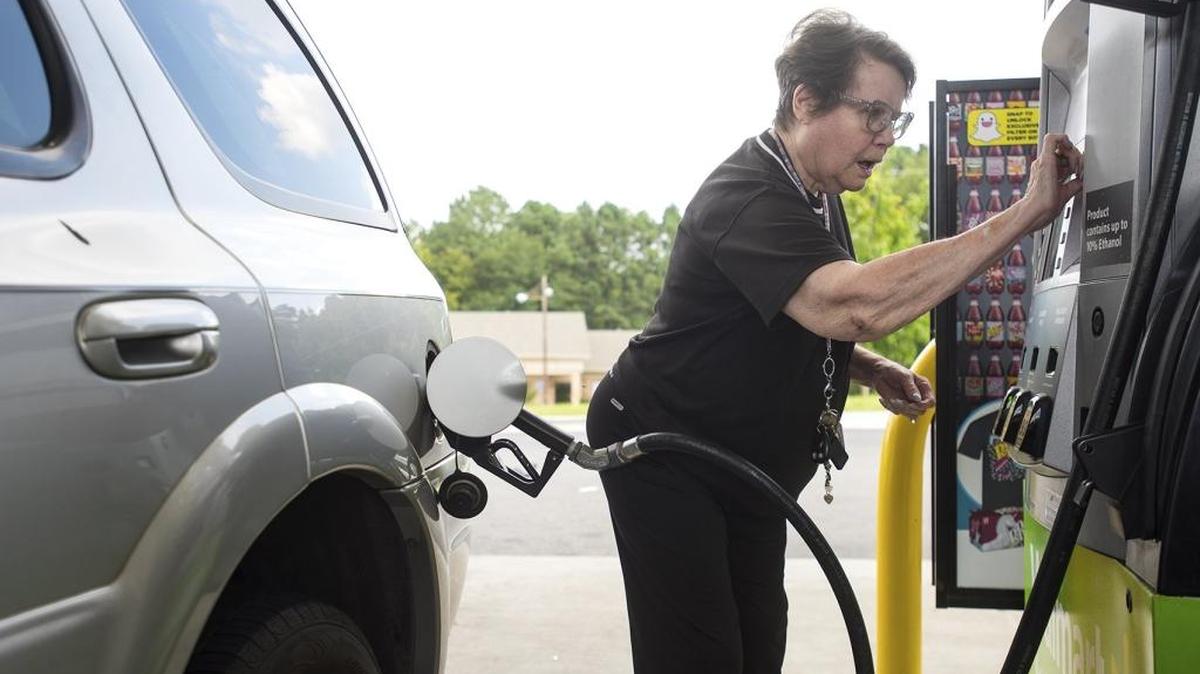 Dollie Chase inserts her card to pay for gas at a Walmart in Tyler, Texas, last week. In North Carolina, gas prices are at a 2-year peak because of the devastation caused by Hurricane Harvey.