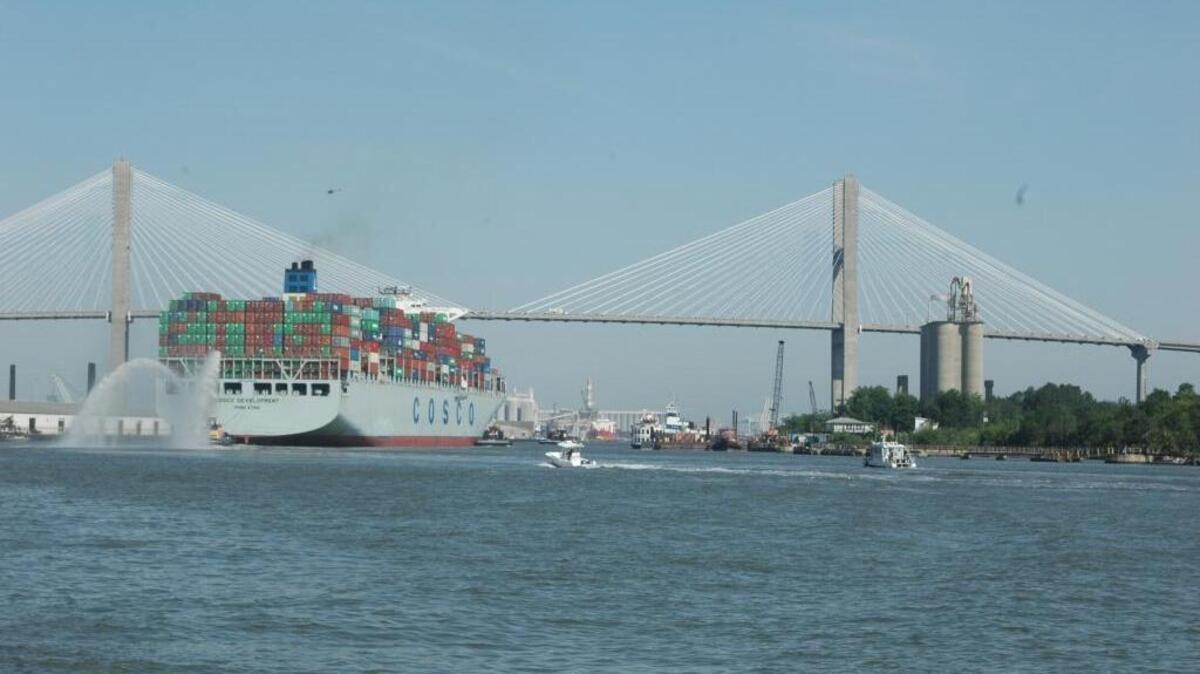 The Cosco Development, the largest container ship to ever call on an East Coast port, crosses under the Talmadge Memorial Bridge en route to the Garden City Terminal on the Savannah River on Thursday.