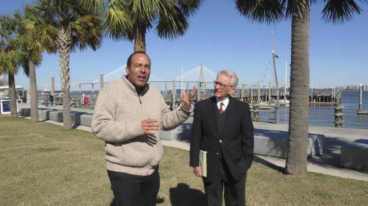 International African American Museum President Michael Moore, left, and former Charleston Mayor Joe Riley discuss plans to build the museum on this site where nearly half of all U.S. slaves first stepped foot on American soil.