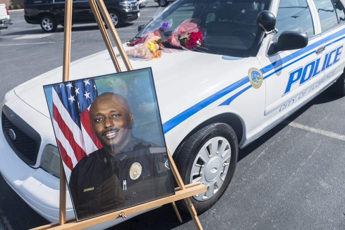 A memorial is placed in front of the First Baptist Church in Florence for Sgt. Terrence Carraway who was shot and killed during a standoff where six other police were injured on Wednesday evening . Oct. 4, 2018