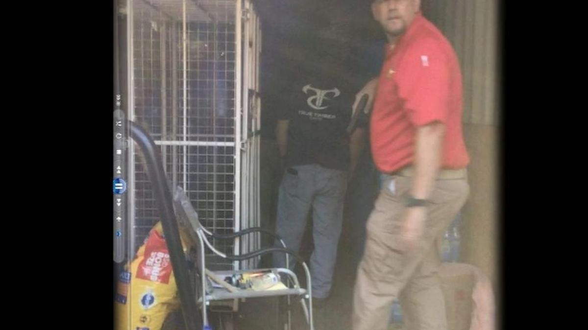 Screen grab shows investigators entering the container where Kala Brown was kept for 2 months.