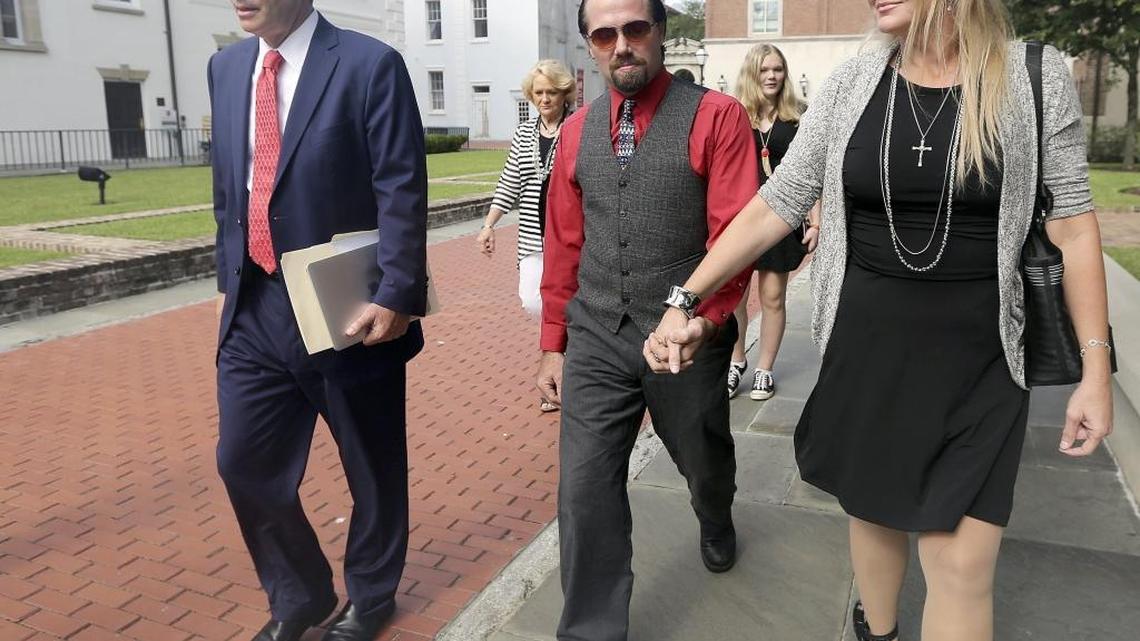 Hand in hand, Sydney and Tammy Moorer leave the courthouse in Charleston after a bond modification hearing on Thursday, Aug. 6, 2015.