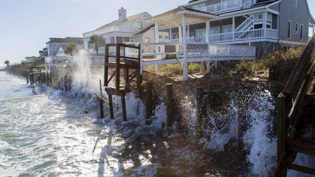 Waves crash against the sea wall during a regular high tide at Garden City Point last fall just days before a “King Tide” event.