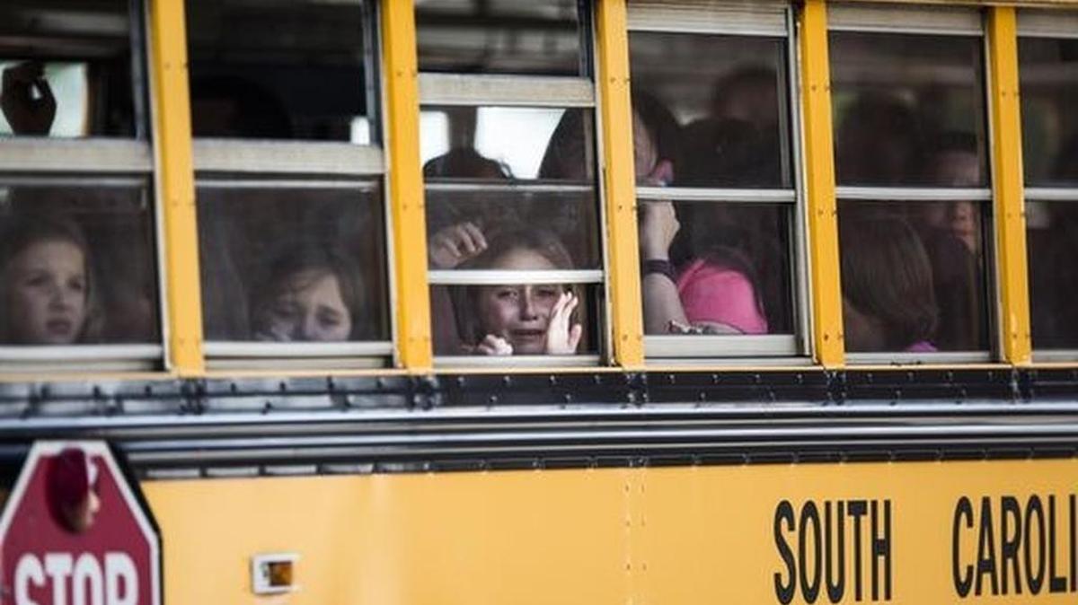 A student weeps after a deadly shooting at Townville Elementary School in September. In the wake of the incident, some state lawmakers have introduced bills that would allow educators to carry guns on campus, but many Upstate educators oppose the idea.