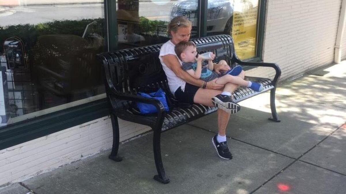 Amid high temperatures Wednesday, Renee Miller of Fort Mill found a cooler spot of shade just off Main Street in downtown Rock Hill. Her three-year-old grandson, Jacob, found the spot equally enjoyable.