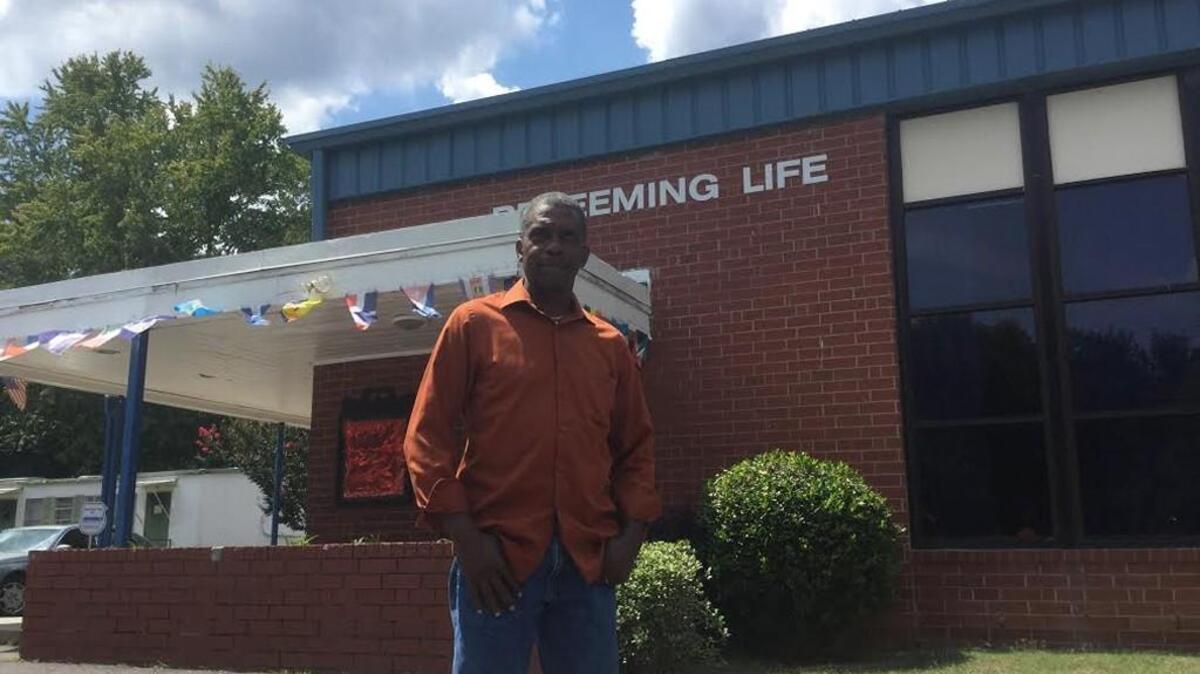 Bishop Eric Gailliard in front of Redeeming Life Christian Center which was hit by a break-in where vandals left human waste on the floor.