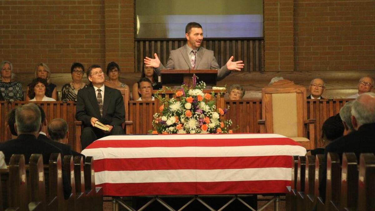 Chuck Sprouse, pastor of First Baptist Church in Ninety Six, speaks about John Drummond’s life during the late senator’s funeral service Wednesday in the church's sanctuary.