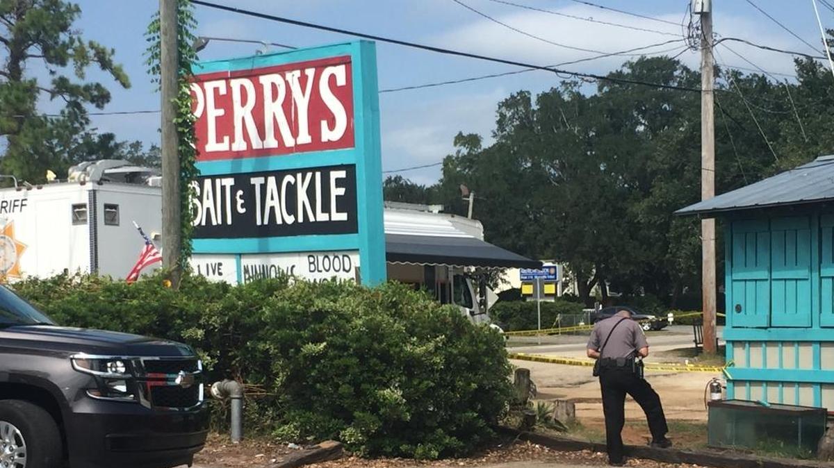 Georgetown County police gather outside of Perry’s Bait and Tackle after the shop was set on fire.
