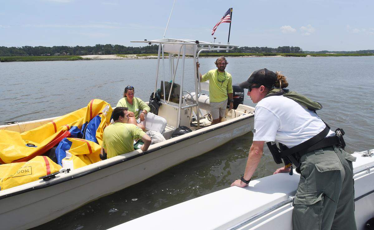 South Carolina Department of Natural Resources law enforcement officer Tara Donahue conducts a boat safety check.