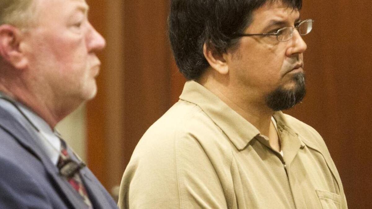 Leon Collier III stands with his attorney, William Thomas Floyd, in Circuit Court in Conway. Collier, charged with murdering his girlfriend, Christian Hope Phipps, and keeping her body in the closet of his Little River apartment, was granted a $250,000 bond today by Circuit Court judge Larry B. Hyman Jr.