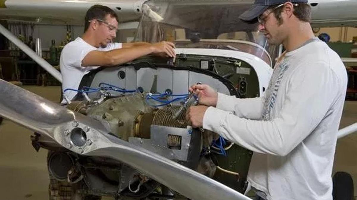 Students with Greenville Technical College's Aircraft Maintenance Program, located next to Lockheed Martin's Greenville facility at the S.C. Technology and Aviation Center, work on a plane.