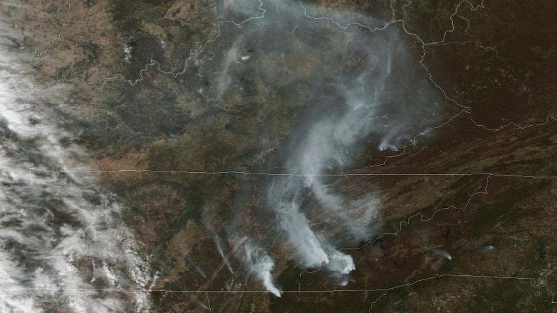 A NOAA satellite image from Monday shows smoke plumes rising out of the mountains of North Carolina.