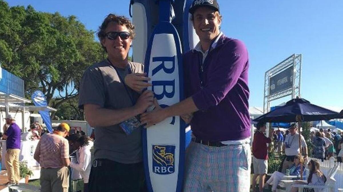 Hudson’s Seafood on the Docks owner Andrew Carmines (left) with life-long friend Shep Rose at RBC Heritage last year on Hilton Head Island.