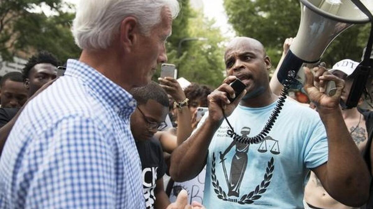 Bruce Willson speaks to Greenville County Administrator Joseph Kernell during a Black Lives Matter demonstration in Greenville on Friday, July 8, 2016.