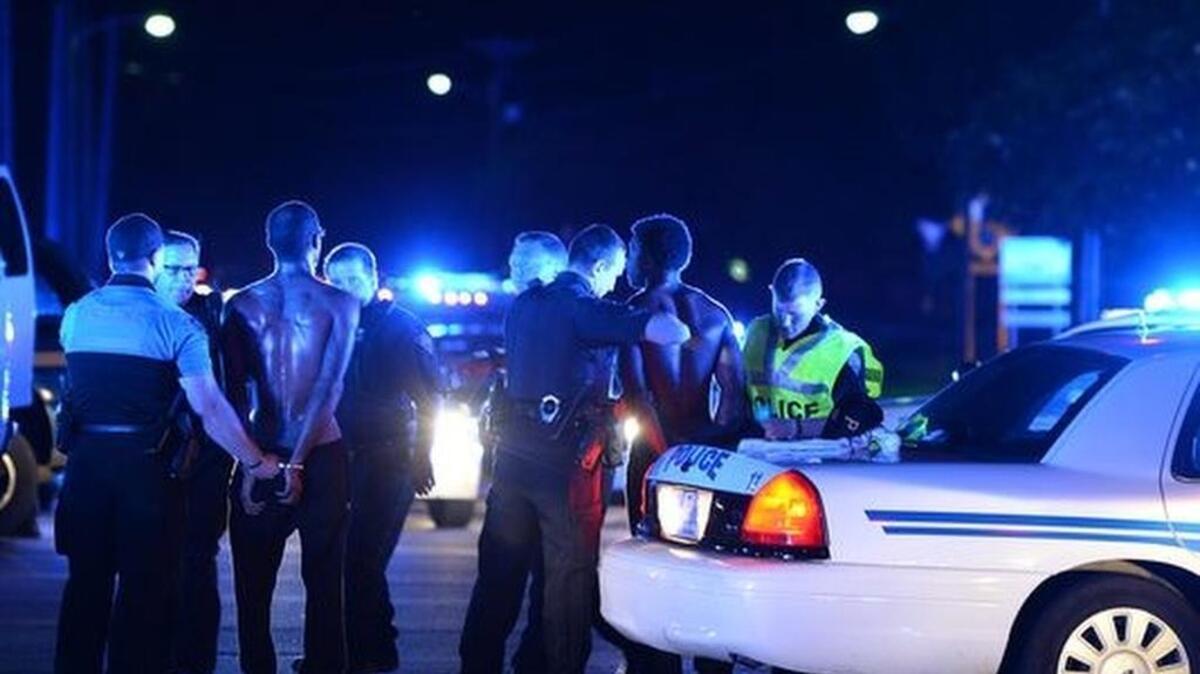 A group of protesters clash with police at the Bon Secours Wellness Arena during a Black Lives Matter rally.