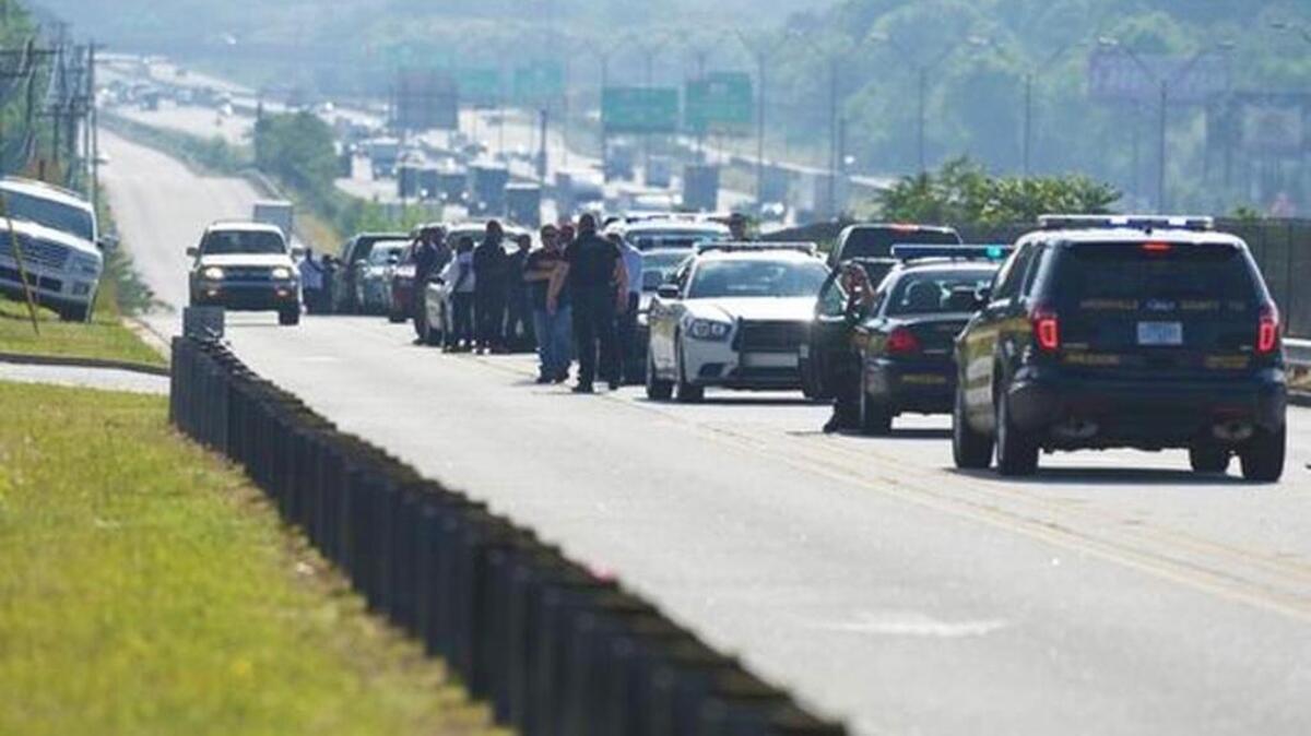 Parents line up waiting to pick up their kids after a shooting at Southside High School on Friday, May 13, 2016.